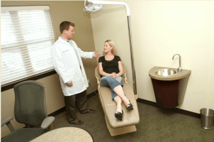 The dentist with a female patient on a dental chair