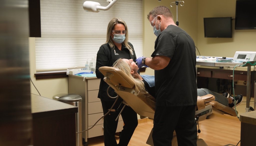 Dr. Molen working on patient in chair
