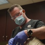 Dr. Moeln working with mask and gloves
