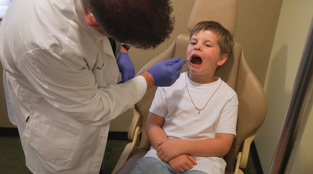 Dr. Molen checking patients teeth