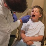 Dr. Molen checking patients teeth