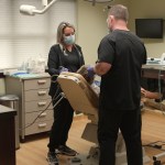 Dr. Molen working with patient in chair