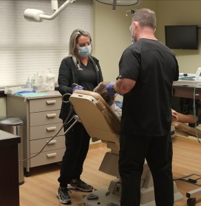 Dr. Molen working with patient in chair