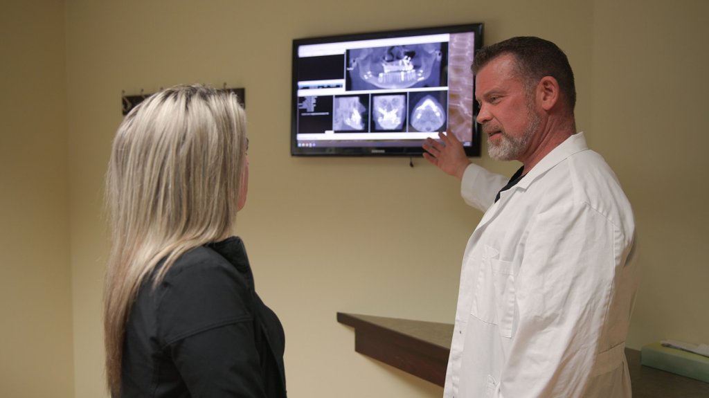 Dr. Molen and patient looking at x-rays