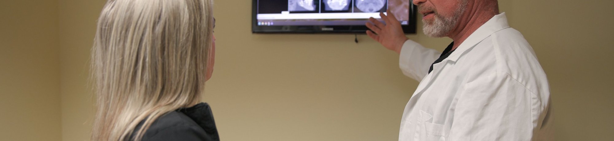 Dr. Molen and patient looking at x-rays